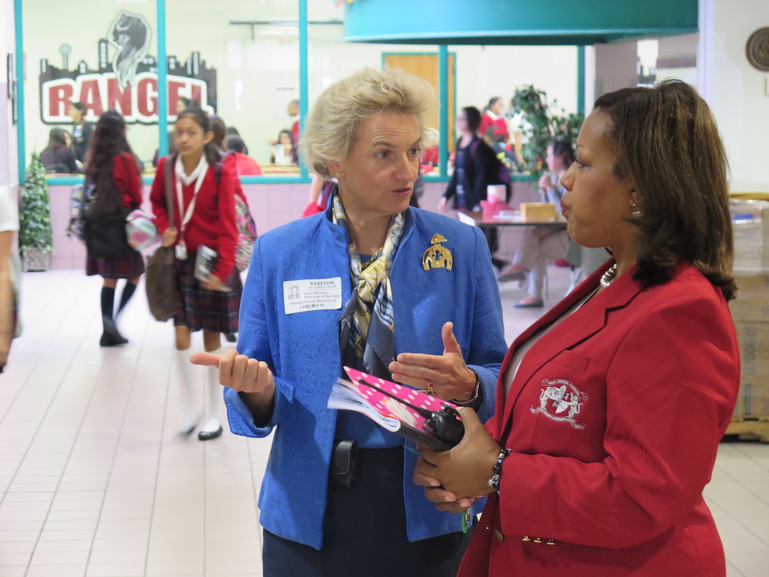 Carol Nichols of Capital One talks with Principal Lisa Curry.