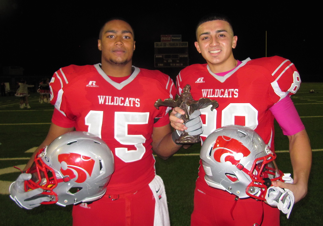 Two Woodrow players hold the Lady of the Lake trophy after a victory of Bryan Adams.