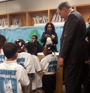 Mayor Mike Rawlings encourages students to recycle.