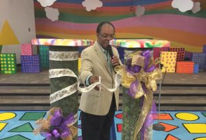 Trustee Lew Blackburn cuts the ribbon at N.W. Harllee Early Childhood Center.