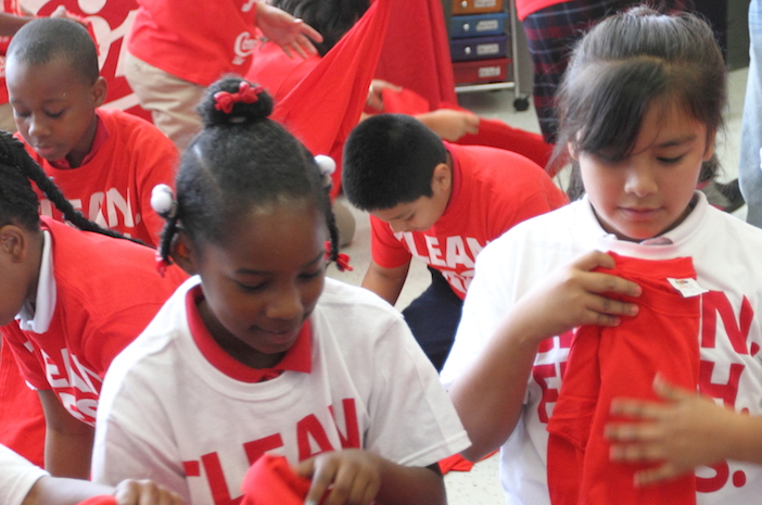 Mills students practice folding laundry.