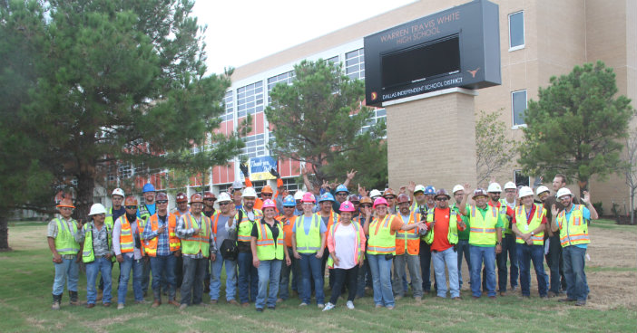 Construction, maintenance workers stretch to prep for first day of classes