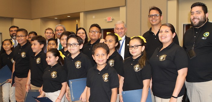Heroic coach and teacher, outstanding robotics team and student app creators recognized by trustees