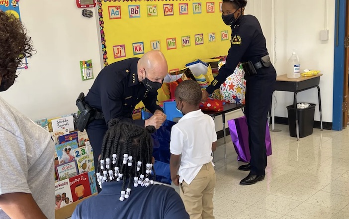 Dallas Police Department and Safer Dallas Better Dallas give out school supplies at Bryan Elementary